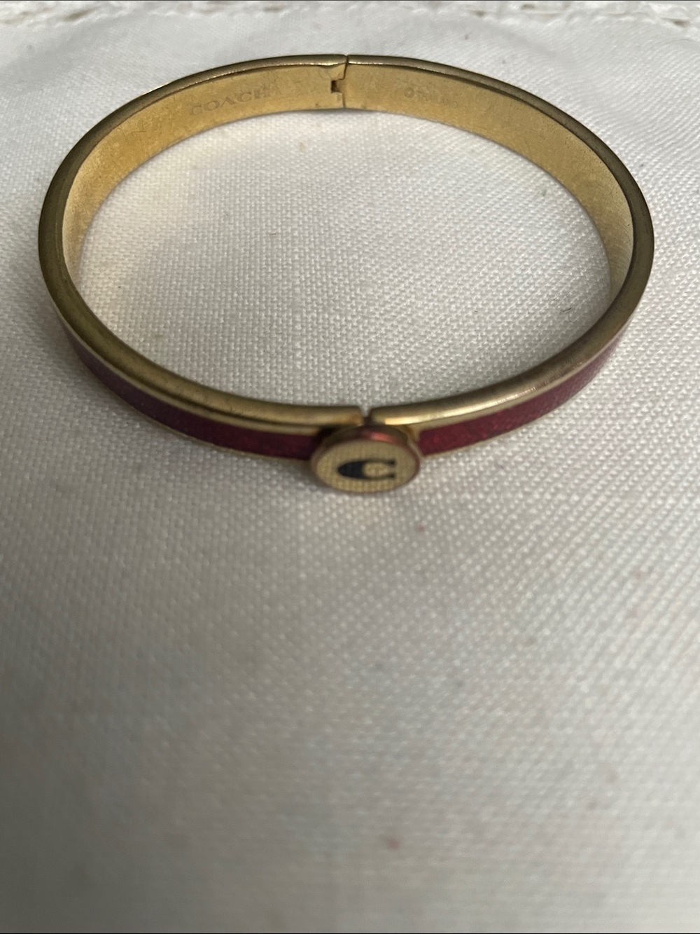 Coach Gold-Tone Bangle with Red Enamel Accent and 'C' Logo